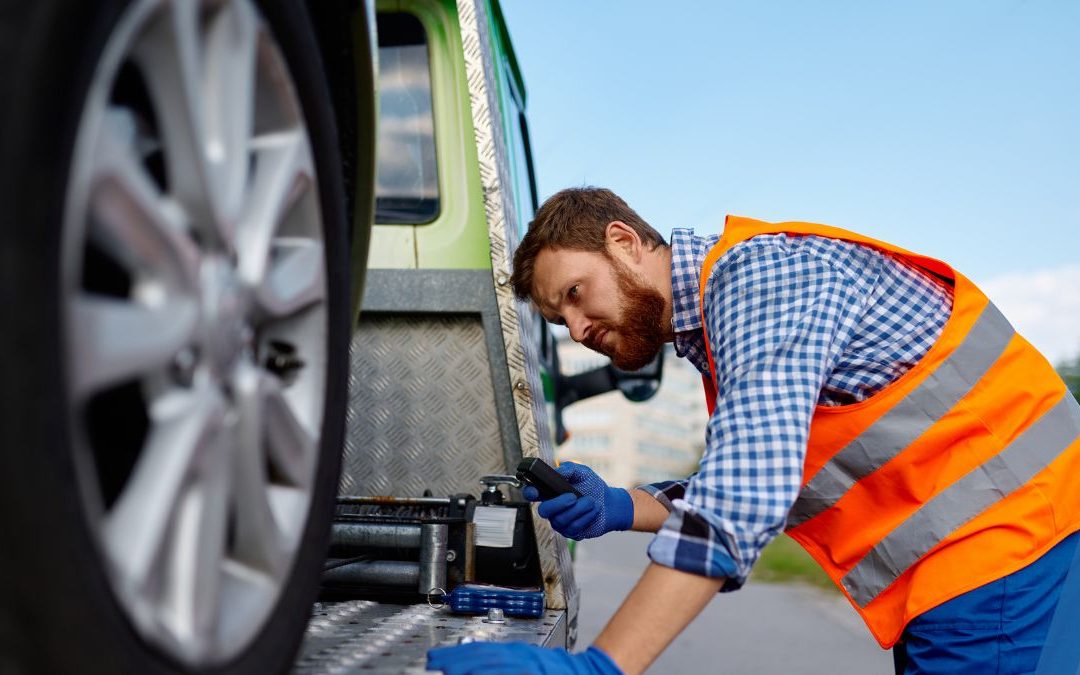 An Expert Inspecting A Truck